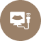 Person seated at a desk with a laptop, representing remote work or a home office setup.